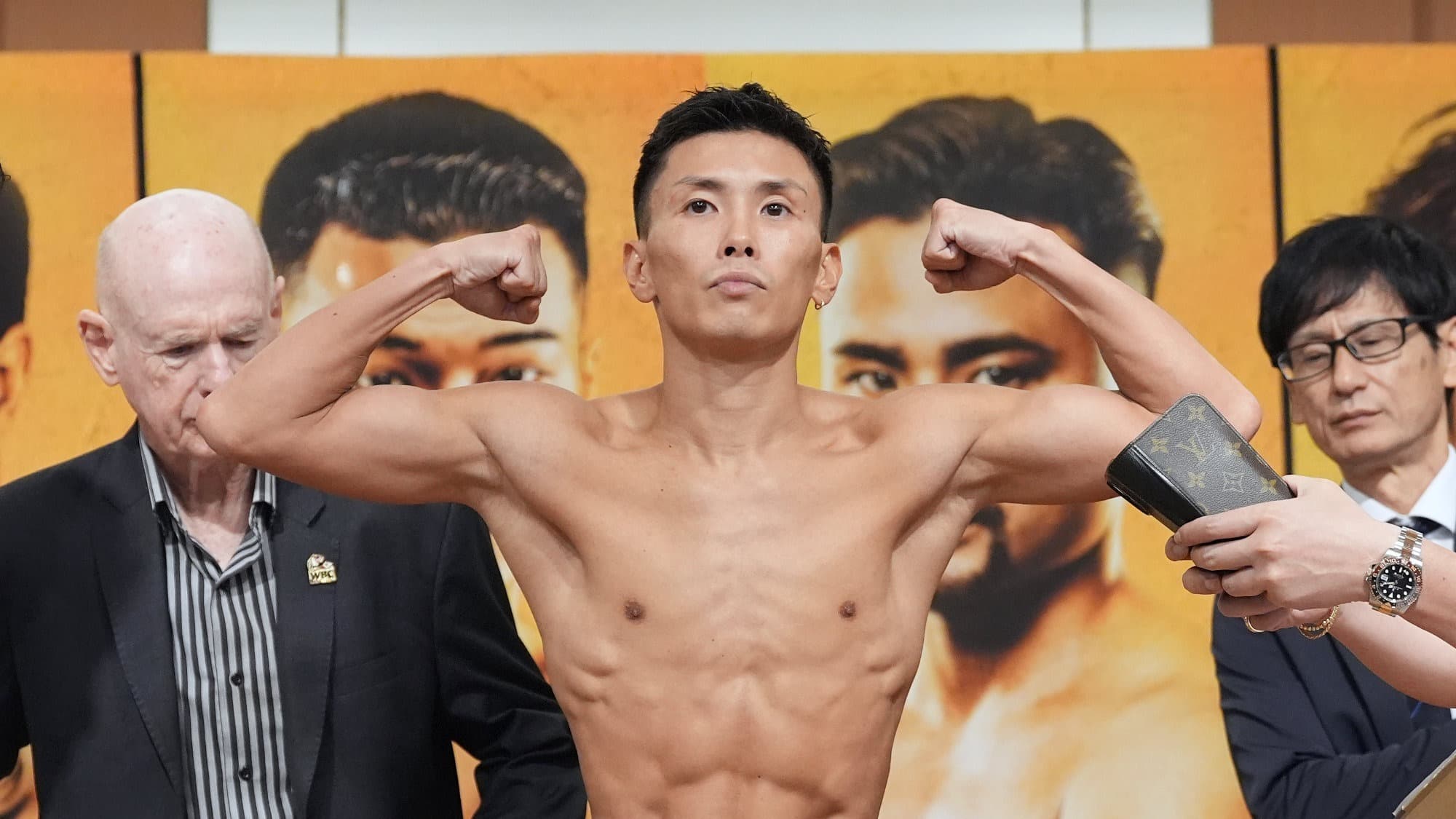 Iwata recovers after knockdown, stops Badillo after 11-round firefight